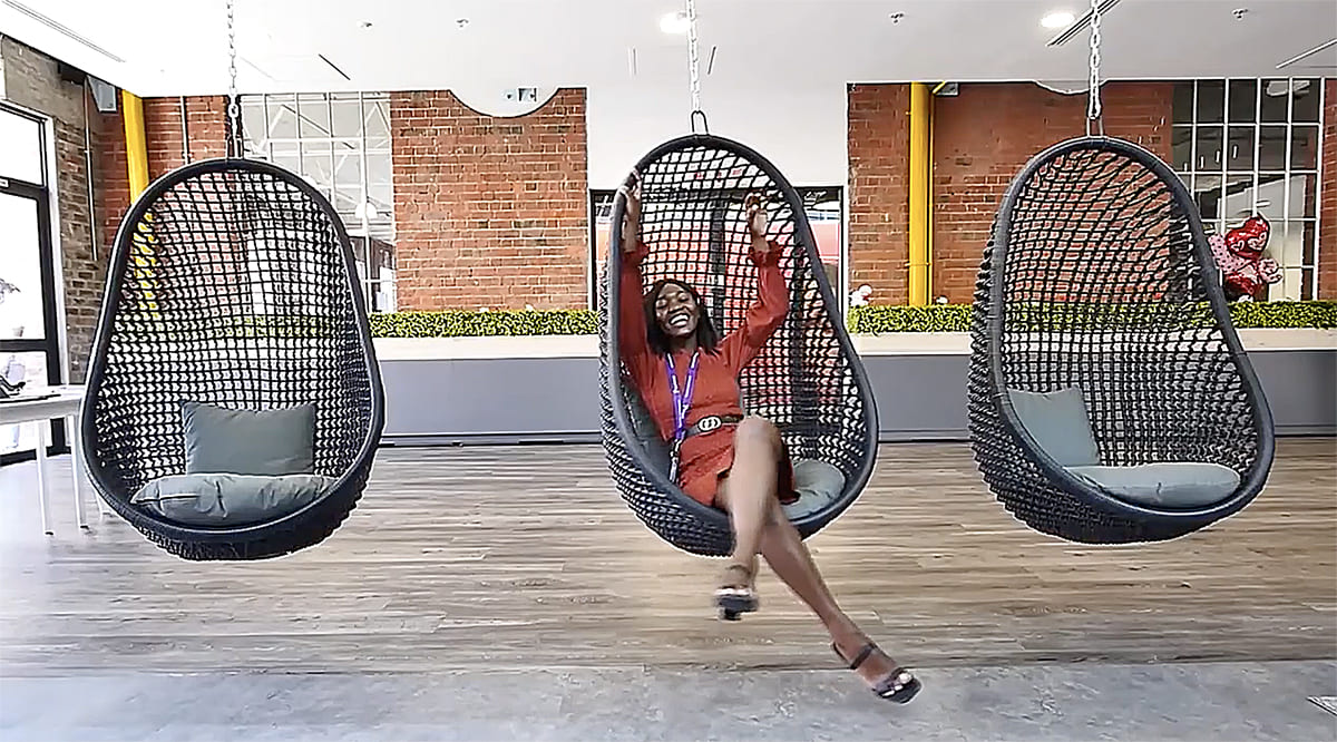 TP in Africa employee having fun in a swing chair