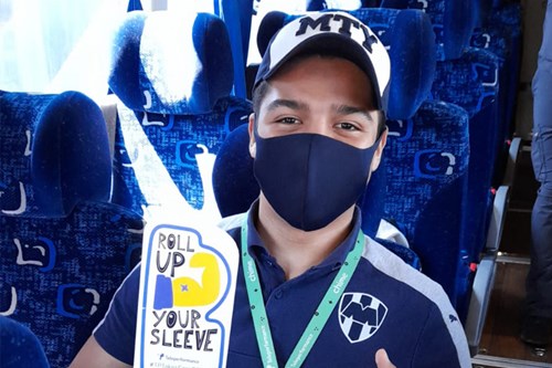 TP employee holding trophy